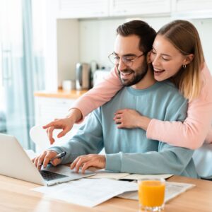 couple exploring SWC Home Builders' range of home options online